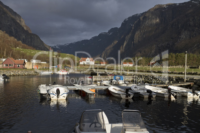 small harbor with mountains in background