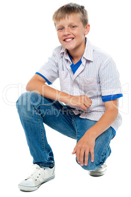 Trendy young boy posing in casuals