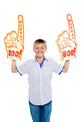 Energetic young boy showing true fan spirit