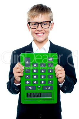 School boy holding calculator upside down