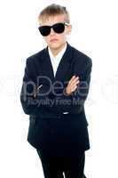 Snapshot of young kid wearing suit and sunglasses