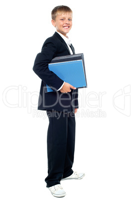 Smiling kid holding files, young business boy