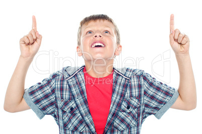 Smiling young child looking up and pointing