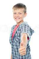 Handsome young boy gesturing thumbs up sign