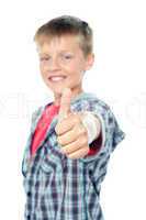 Adorable young caucasian boy showing thumbs up sign