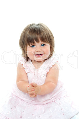 Cheerful baby girl in pink frock