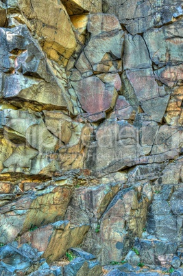 Wall of Bassalt Rock With Cracks