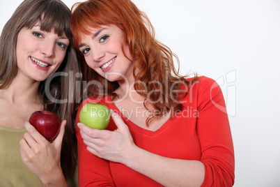 duo of girls with apples