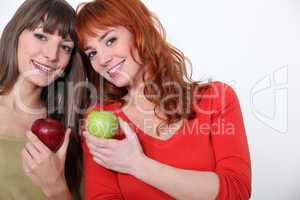 duo of girls with apples