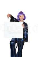 Woman in Seventies costume and wig holding blank board