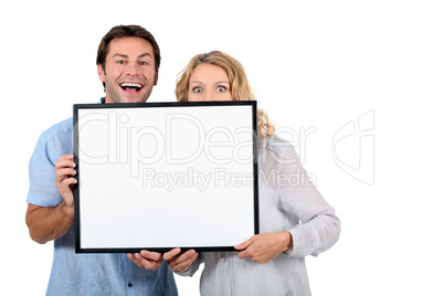 Couple with advertising board