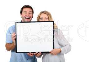 Couple with advertising board