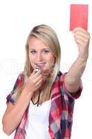 Girl holding up red card