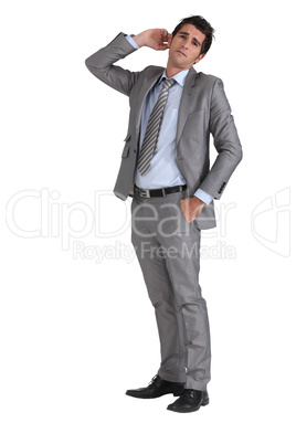 Businessman with hand to ear