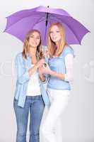 Girls under a purple umbrella