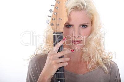 Woman holding an electric guitar