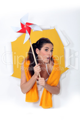 Woman holding toy windmill
