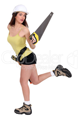 Attractive female builder with hand saw