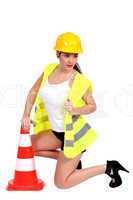 portrait of sexy female builder with construction cone