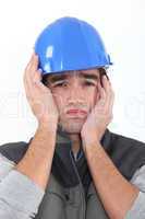 A depressed construction worker.