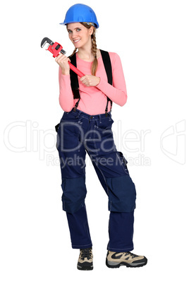 craftswoman holding a spanner