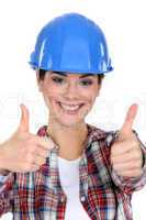 Smiling tradeswoman giving two thumb's up