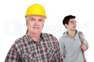 Senior laborer and young man