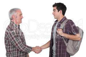 Two casual men shaking hands