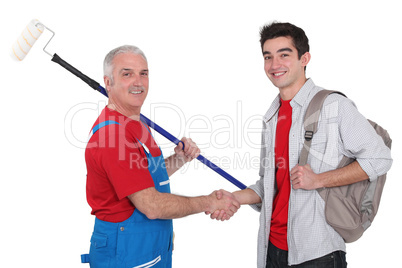 Painter and young man shaking hands