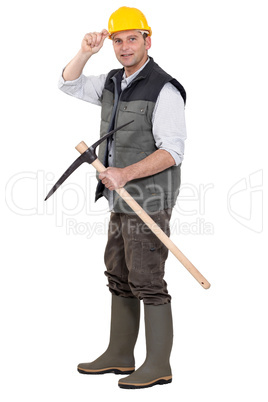 Workman with pickaxe on white background