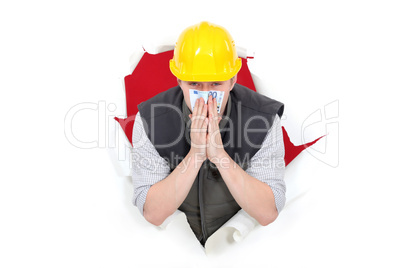 Builder smelling bank note