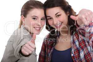 Young women giving the thumb's up