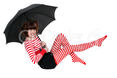 Woman holding an umbrella and floating in the air