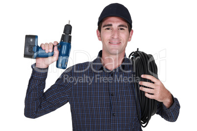 Electrician with a drill