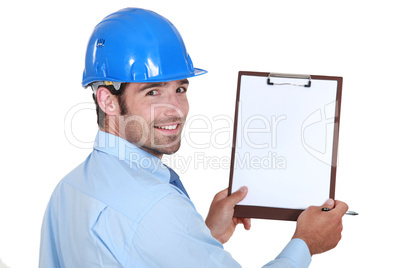 Architect holding clip-board and pen