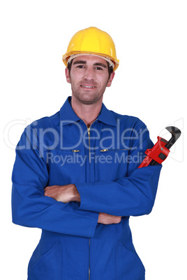 Builder holding red wrench