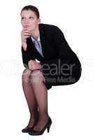 businesswoman thinking and holding her chin