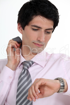 Businessman checking the time