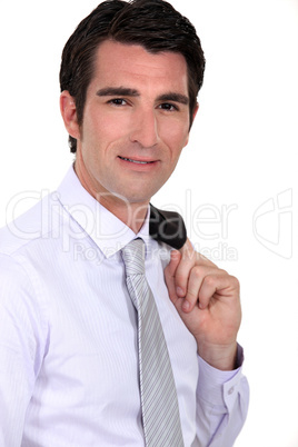 Businessman with his jacket over his shoulder