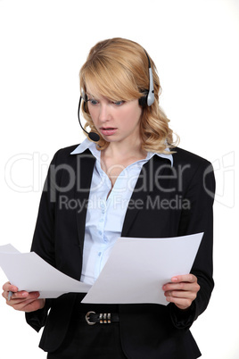 Surprised receptionist looking at some paperwork