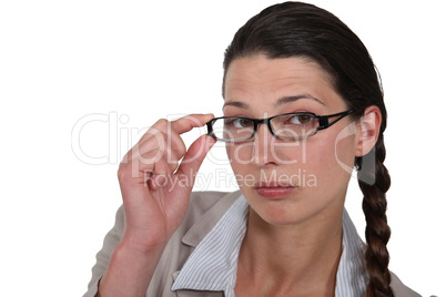 Woman adjusting her glasses