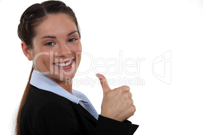 A businesswoman giving the thumb up.