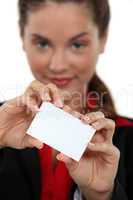 Businesswoman displaying business card