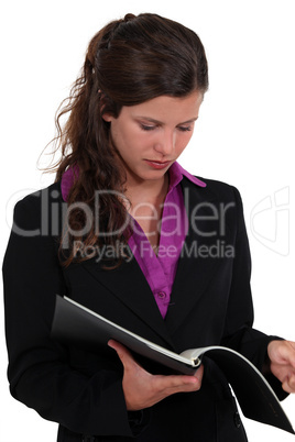 Brunette reading contents of folder