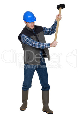 Builder using sledge-hammer