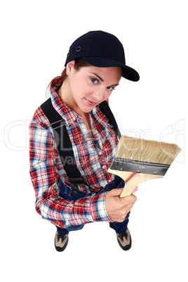 Woman showing paintbrush