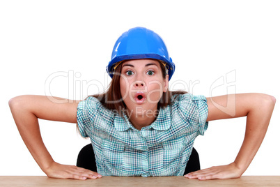 Expressive woman sitting at her desk