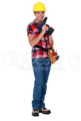 Female worker with a drill