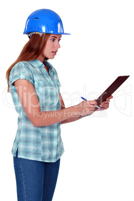 Shocked woman holding clipboard