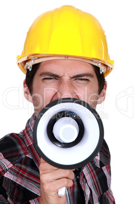A construction worker calling a strike.